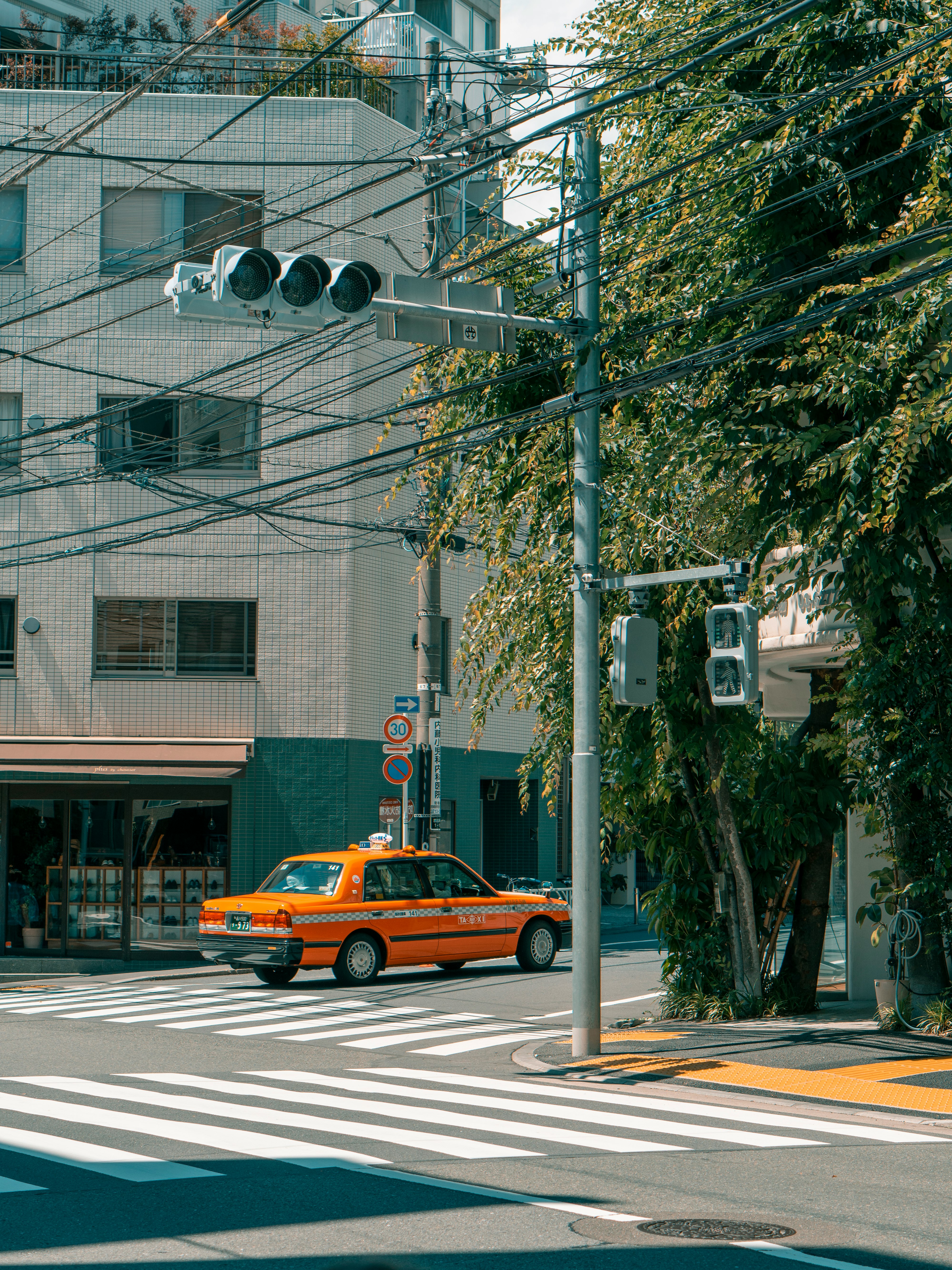 yellow cab on road during daytime